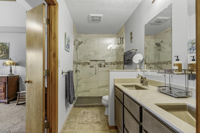2515 S Laurel Ave, Springfield, MO 65807 - full bath featuring toilet, a marble finish shower, double vanity, baseboards, and a textured ceiling