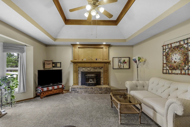 2515 S Laurel Ave, Springfield, MO 65807 - carpeted living room with ceiling fan, vaulted ceiling, a raised ceiling, ornamental molding, and a brick fireplace