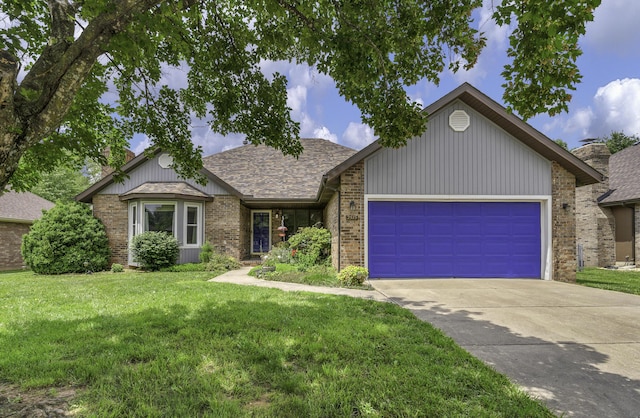 2515 S Laurel Ave, Springfield, MO 65807 - view of front of house with a garage, a front lawn, concrete driveway, brick siding, and a chimney