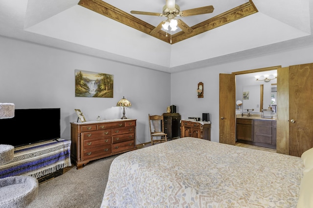2515 S Laurel Ave, Springfield, MO 65807 - bedroom with carpet flooring, a raised ceiling, connected bathroom, a sink, and ceiling fan