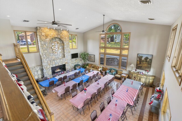 40 Overton Ct, Kimberling City, MO 65686 - living room with a ceiling fan, lofted ceiling, a fireplace, and stairs