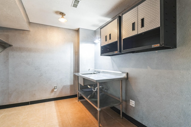1888 S High Rdg, Nixa, MO 65714 - clothes washing area with light tile patterned flooring