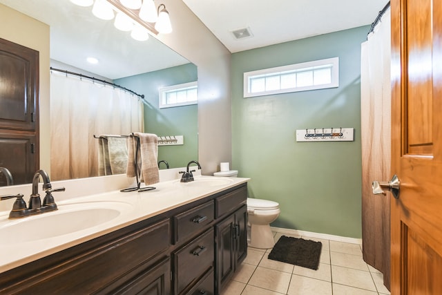 1888 S High Rdg, Nixa, MO 65714 - bathroom with toilet, tile patterned flooring, double vanity, and baseboards
