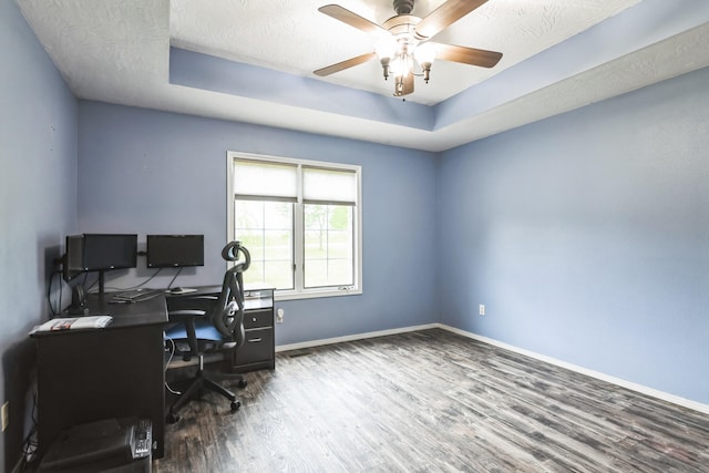 1888 S High Rdg, Nixa, MO 65714 - office space featuring wood finished floors, a tray ceiling, baseboards, ceiling fan, and a textured ceiling