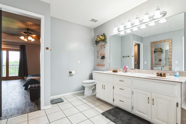 1888 S High Rdg, Nixa, MO 65714 - bathroom with ensuite bath, toilet, baseboards, double vanity, and tile patterned flooring
