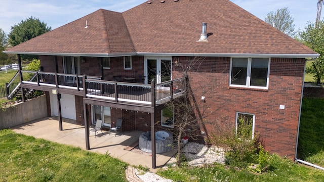 1888 S High Rdg, Nixa, MO 65714 - back of property with roof with shingles, brick siding, a patio area, and a deck