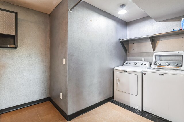 1888 S High Rdg, Nixa, MO 65714 - laundry area with separate washer and dryer, light tile patterned floors, and baseboards