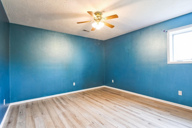 1888 S High Rdg, Nixa, MO 65714 - empty room with ceiling fan, wood finished floors, and baseboards