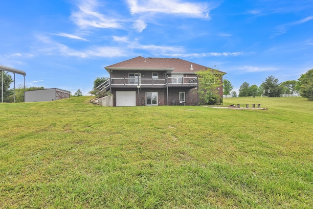 1888 S High Rdg, Nixa, MO 65714 - rear view of house featuring a lawn, a garage, and a wooden deck