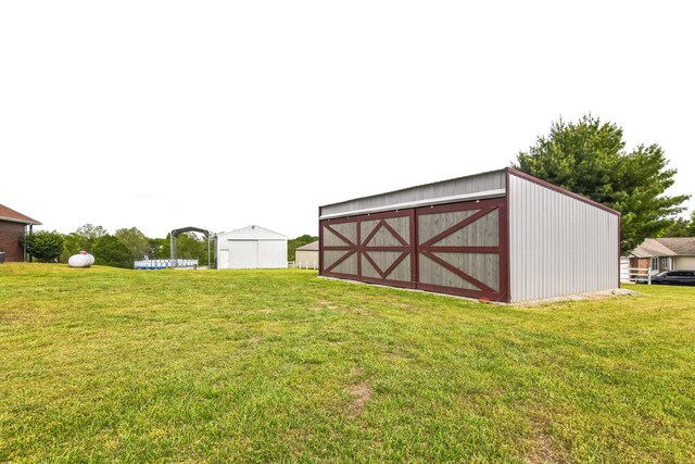 1888 S High Rdg, Nixa, MO 65714 - view of green lawn featuring an outbuilding and an outdoor structure