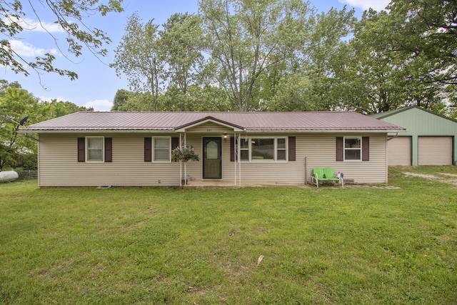 641 Eagle Ave, Norwood, MO 65717 - single story home featuring a garage, a front lawn, metal roof, and an outdoor structure
