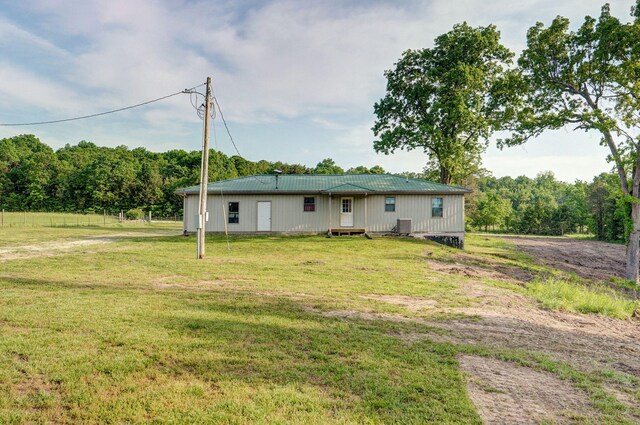 2121 E 505th Rd, Halfway, MO 65663 - back of house with a lawn and metal roof
