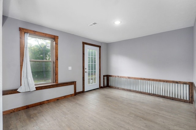 2121 E 505th Rd, Halfway, MO 65663 - unfurnished room with wood finished floors, baseboards, and recessed lighting