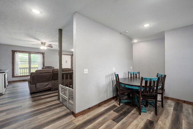 2121 E 505th Rd, Halfway, MO 65663 - dining room with wood finished floors, a textured ceiling, baseboards, and a ceiling fan