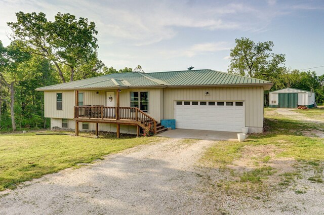 2121 E 505th Rd, Halfway, MO 65663 - view of front of home featuring dirt driveway, an attached garage, a porch, a front lawn, and metal roof