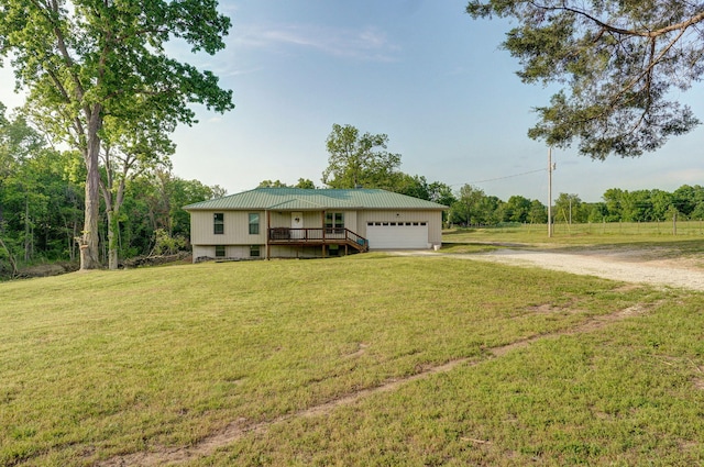 2121 E 505th Rd, Halfway, MO 65663 - view of front of property with a garage, a front yard, driveway, and metal roof