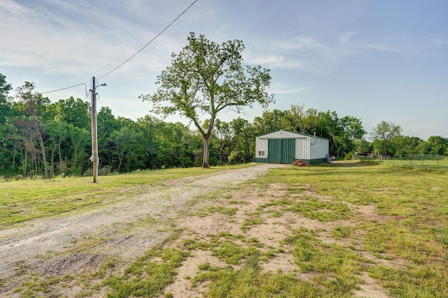 2121 E 505th Rd, Halfway, MO 65663 - view of yard with an outbuilding, driveway, and a detached garage