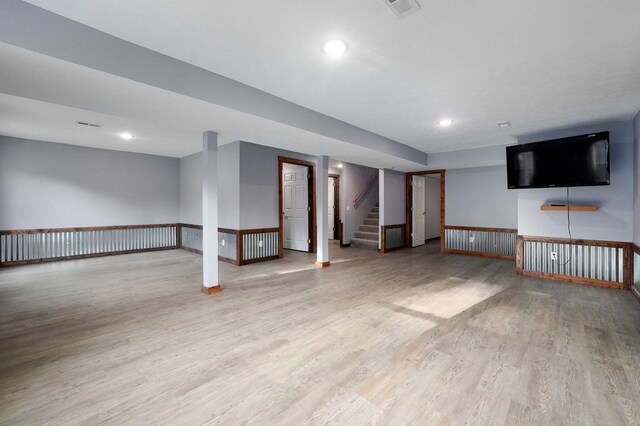 2121 E 505th Rd, Halfway, MO 65663 - finished below grade area with wood finished floors, recessed lighting, baseboards, and stairway