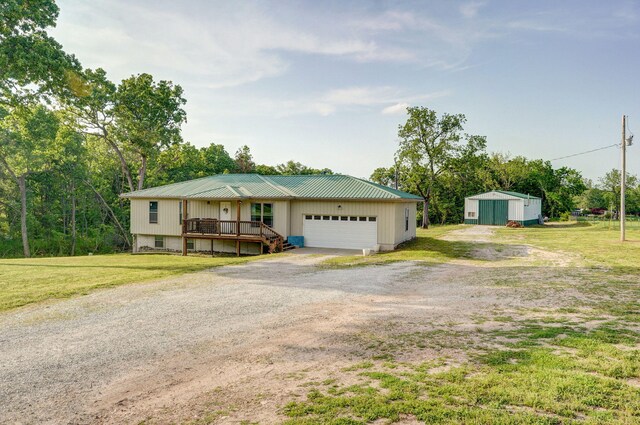 2121 E 505th Rd, Halfway, MO 65663 - view of front of property with driveway, a garage, and a front yard