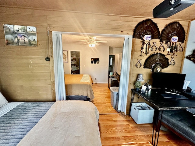 64 Deer Park Cir, Kimberling City, MO 65686 - bedroom featuring wood finished floors, wooden walls, and baseboards