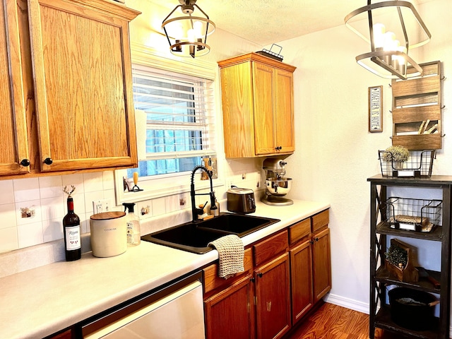 64 Deer Park Cir, Kimberling City, MO 65686 - kitchen featuring a chandelier, a sink, decorative backsplash, dishwasher, and dark wood finished floors