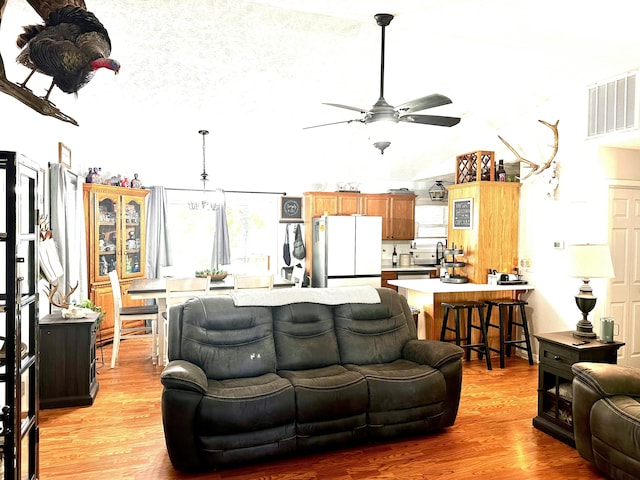 64 Deer Park Cir, Kimberling City, MO 65686 - living area with ceiling fan, light wood finished floors, and lofted ceiling