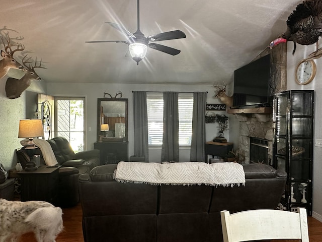 64 Deer Park Cir, Kimberling City, MO 65686 - living area featuring wood finished floors, a ceiling fan, and a fireplace