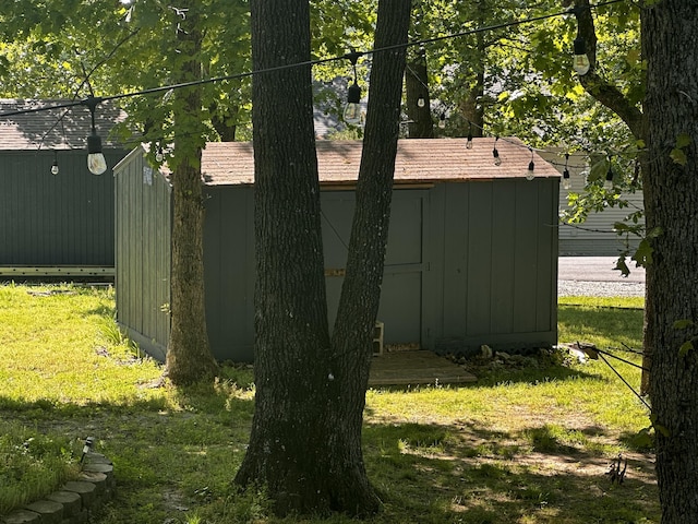 64 Deer Park Cir, Kimberling City, MO 65686 - view of grassy yard with a shed and an outbuilding