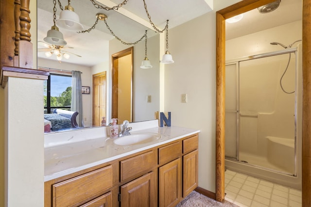 1065 Nicks Rd, Bradleyville, MO 65614 - bathroom featuring a shower stall, vanity, ceiling fan, and ensuite bath
