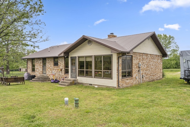 1065 Nicks Rd, Bradleyville, MO 65614 - back of house with metal roof, a chimney, a lawn, and brick siding