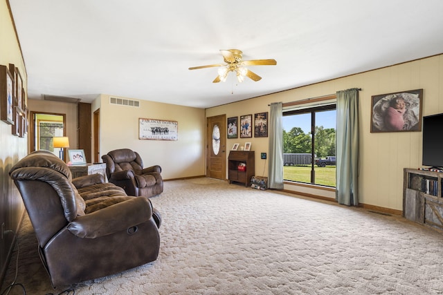 1065 Nicks Rd, Bradleyville, MO 65614 - living room featuring ceiling fan, baseboards, and carpet