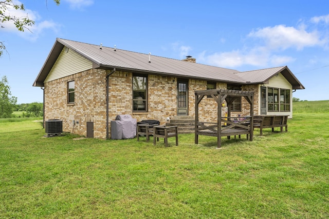 1065 Nicks Rd, Bradleyville, MO 65614 - back of house with a pergola, a lawn, and brick siding