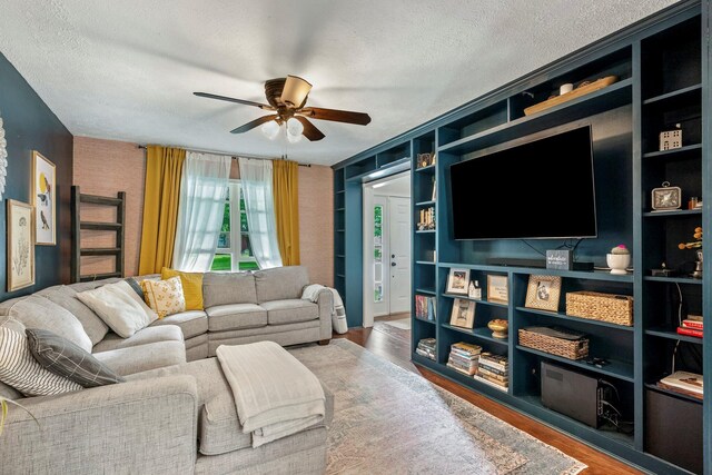 178 S Peach Tree Ln, Republic, MO 65738 - living area featuring ceiling fan, wood finished floors, and a textured ceiling