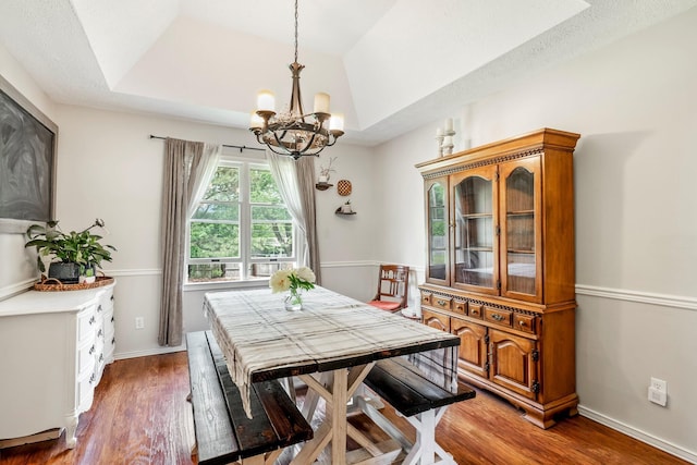 178 S Peach Tree Ln, Republic, MO 65738 - dining area featuring a chandelier, wood finished floors, a raised ceiling, and baseboards