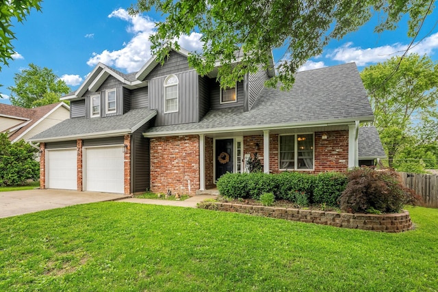 178 S Peach Tree Ln, Republic, MO 65738 - view of front of home featuring concrete driveway, a shingled roof, brick siding, and board and batten siding