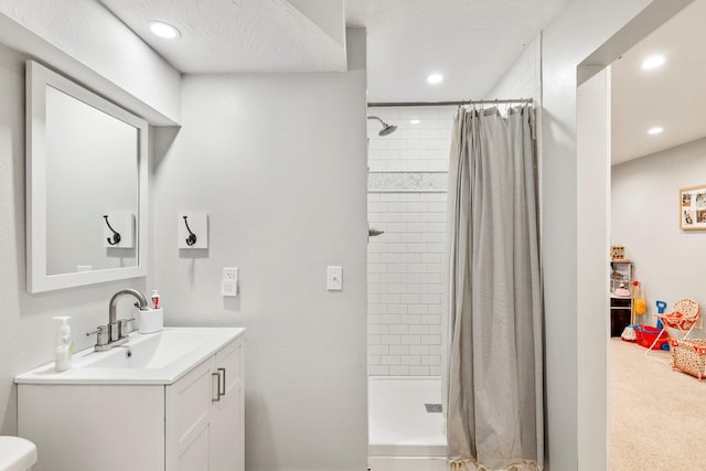 178 S Peach Tree Ln, Republic, MO 65738 - bathroom featuring a tile shower, recessed lighting, and vanity