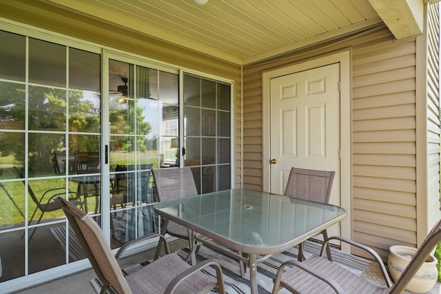 sunroom with outdoor dining space