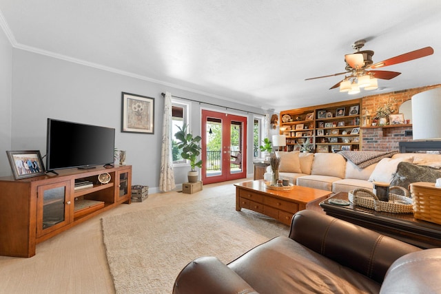 77 Johnson Way Ln, Kimberling City, MO 65686 - living room featuring crown molding, light carpet, french doors, ceiling fan, and a brick fireplace