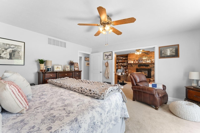 77 Johnson Way Ln, Kimberling City, MO 65686 - bedroom featuring light colored carpet, ceiling fan, baseboards, and a brick fireplace