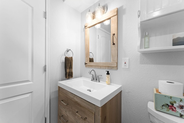 77 Johnson Way Ln, Kimberling City, MO 65686 - bathroom with vanity, a textured wall, and toilet