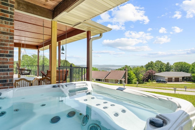 77 Johnson Way Ln, Kimberling City, MO 65686 - view of patio with a hot tub