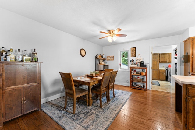 77 Johnson Way Ln, Kimberling City, MO 65686 - dining room featuring a ceiling fan, light wood-type flooring, and baseboards