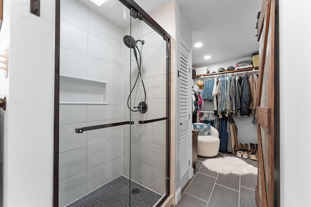 77 Johnson Way Ln, Kimberling City, MO 65686 - bathroom with a stall shower, a spacious closet, recessed lighting, and tile patterned floors