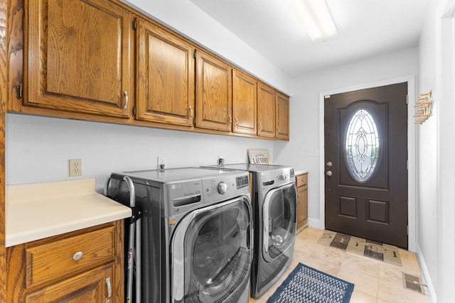 77 Johnson Way Ln, Kimberling City, MO 65686 - laundry room featuring cabinet space, washing machine and dryer, baseboards, and light tile patterned flooring