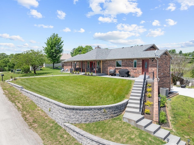 77 Johnson Way Ln, Kimberling City, MO 65686 - view of front of house with brick siding, a front lawn, roof with shingles, a patio area, and a chimney