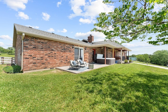 77 Johnson Way Ln, Kimberling City, MO 65686 - back of property with a chimney, an outdoor hangout area, brick siding, and a patio