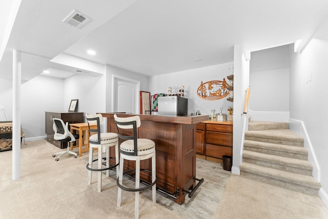77 Johnson Way Ln, Kimberling City, MO 65686 - indoor dry bar featuring freestanding refrigerator, stairway, baseboards, recessed lighting, and light wood-style floors