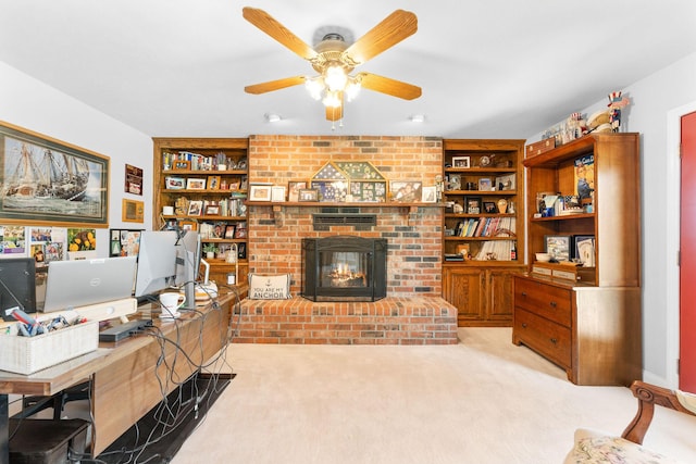 77 Johnson Way Ln, Kimberling City, MO 65686 - home office featuring a ceiling fan, light colored carpet, built in shelves, and a fireplace