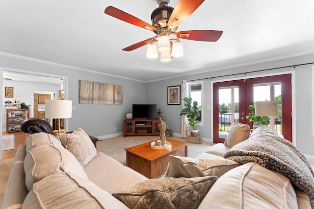 77 Johnson Way Ln, Kimberling City, MO 65686 - living area with a ceiling fan, crown molding, french doors, baseboards, and light carpet