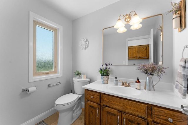 77 Johnson Way Ln, Kimberling City, MO 65686 - bathroom with a chandelier, vanity, toilet, baseboards, and tile patterned floors